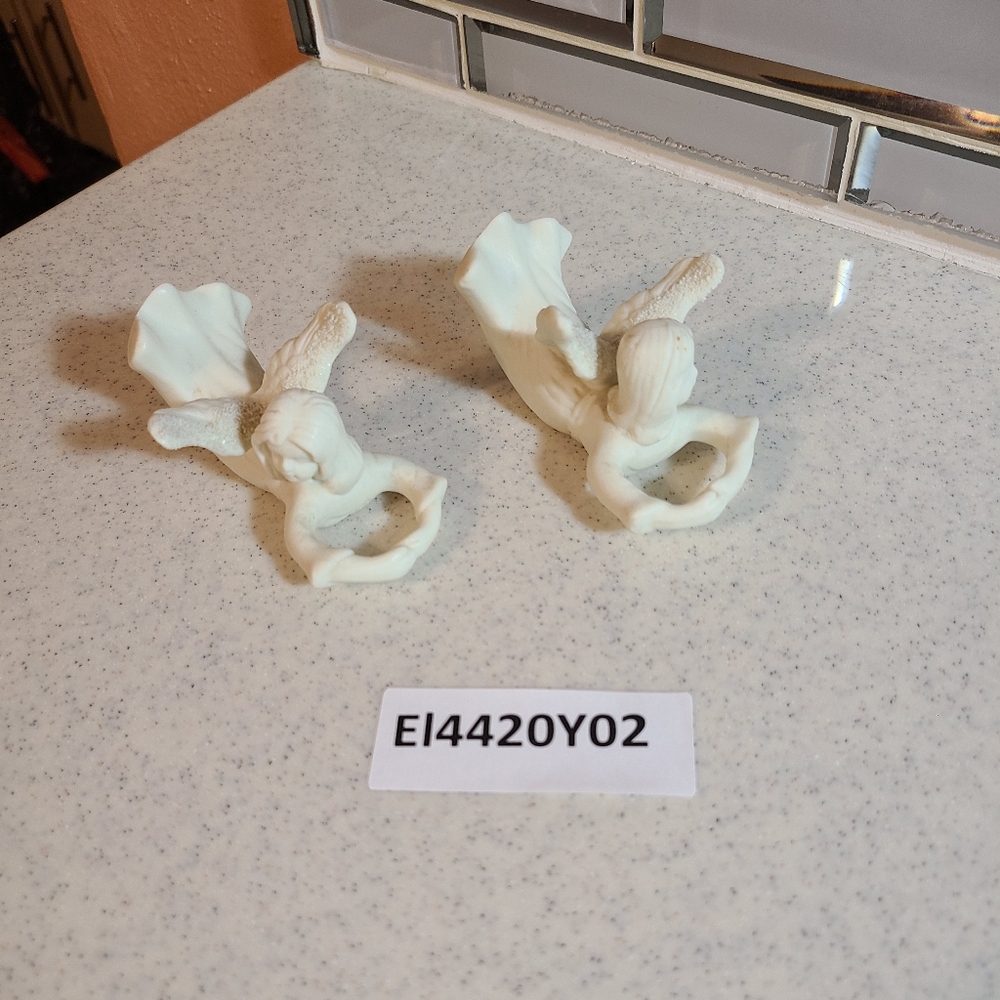 Two Angel laying figurine for sale